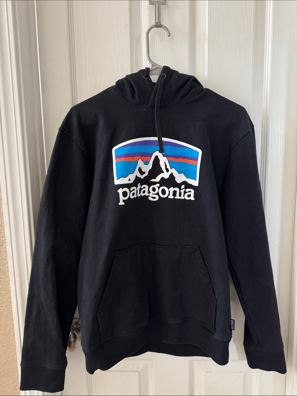 Patagonia Black Pullover Hoodie with Blue & Red Mountain Logo